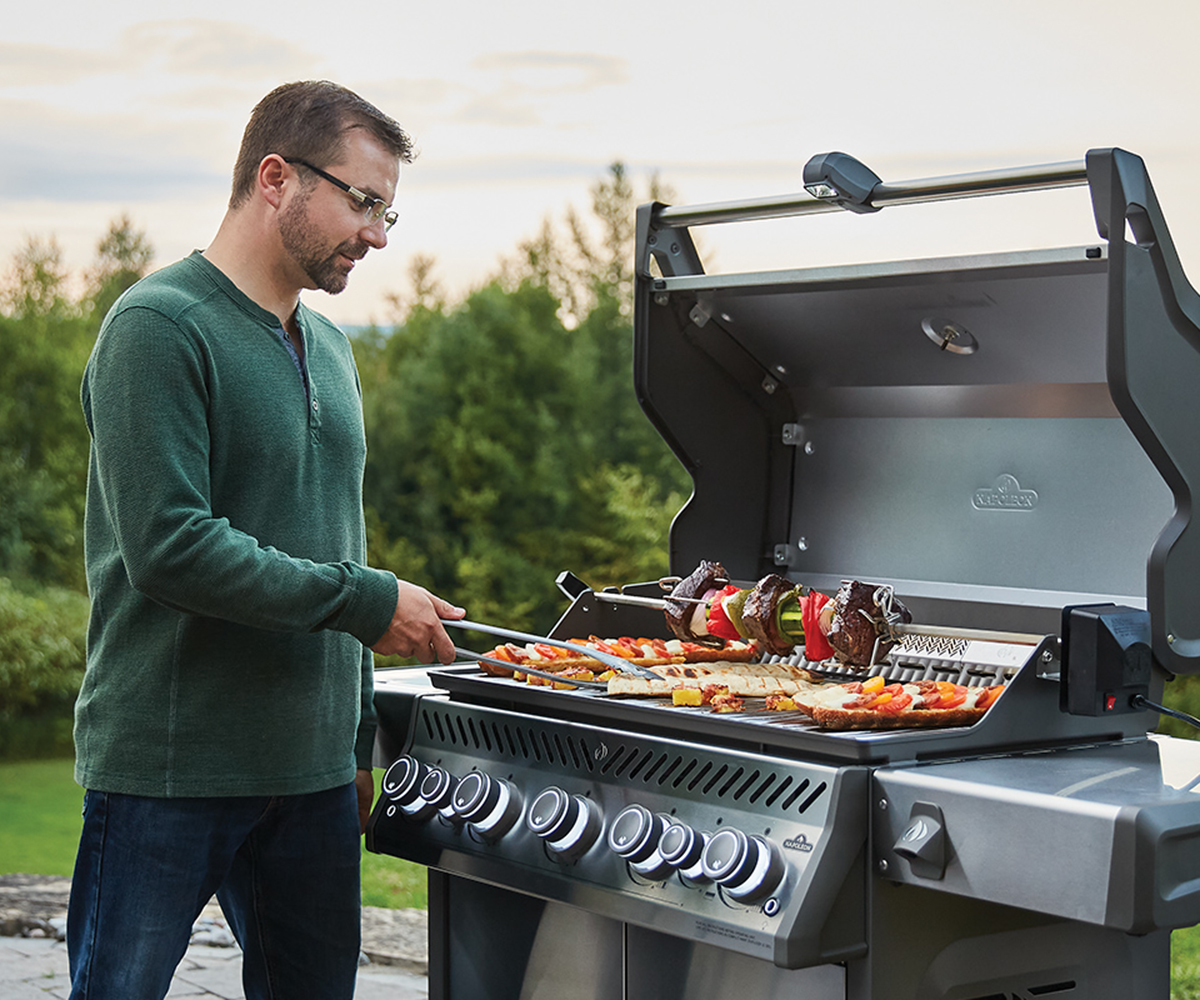 Man working on grill