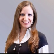 a woman smiling for the camera