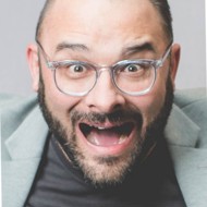 a man with glasses and a beard