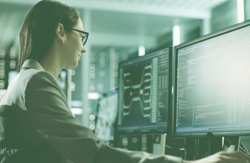 a woman looking at a computer screen