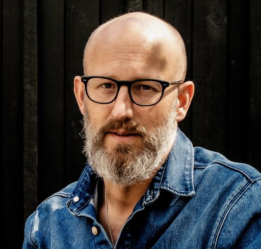 a man with a beard and glasses