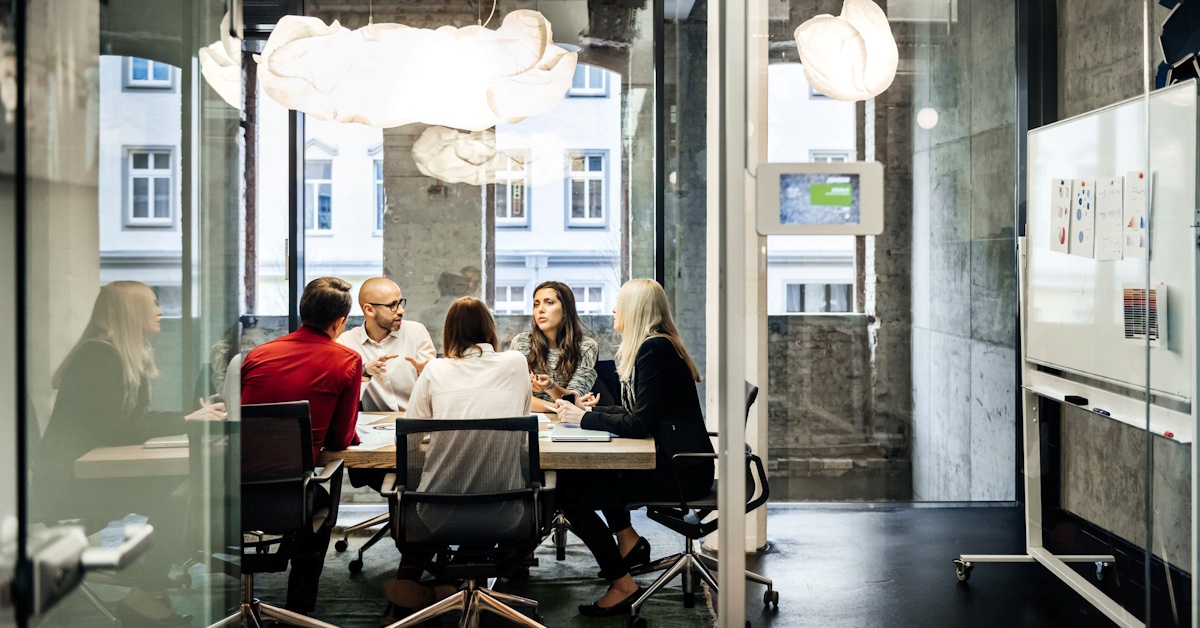 a group of people sitting at a table