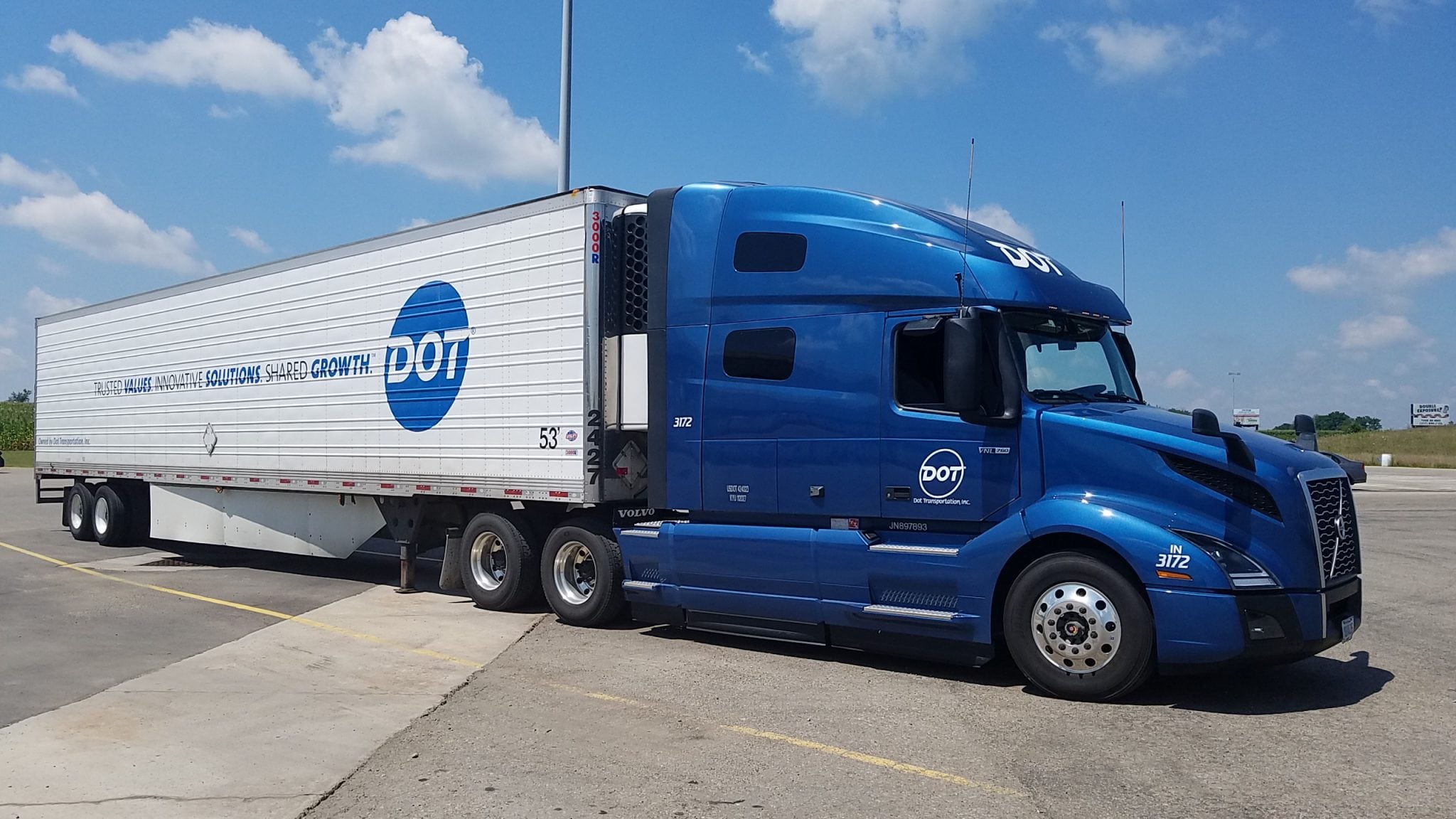 a blue truck with a trailer