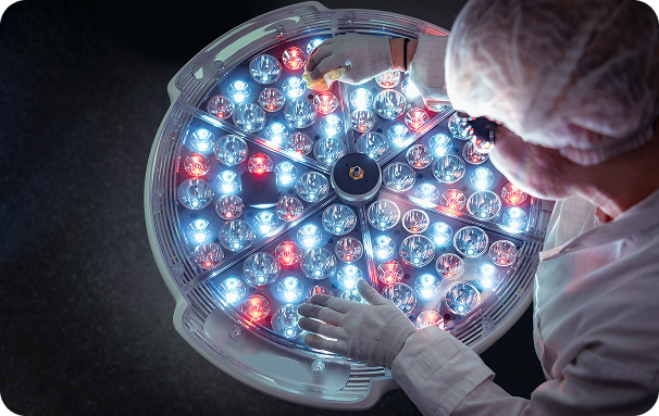 a person holding a tray of colorful balls