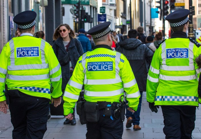 a group of police officers walking down a street