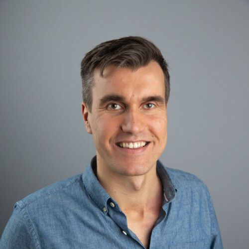 a man smiling for the camera