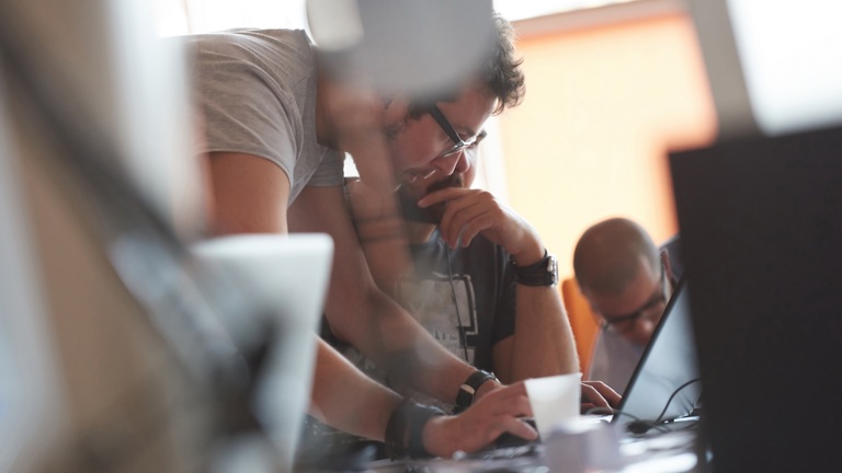 Developers in front of computer