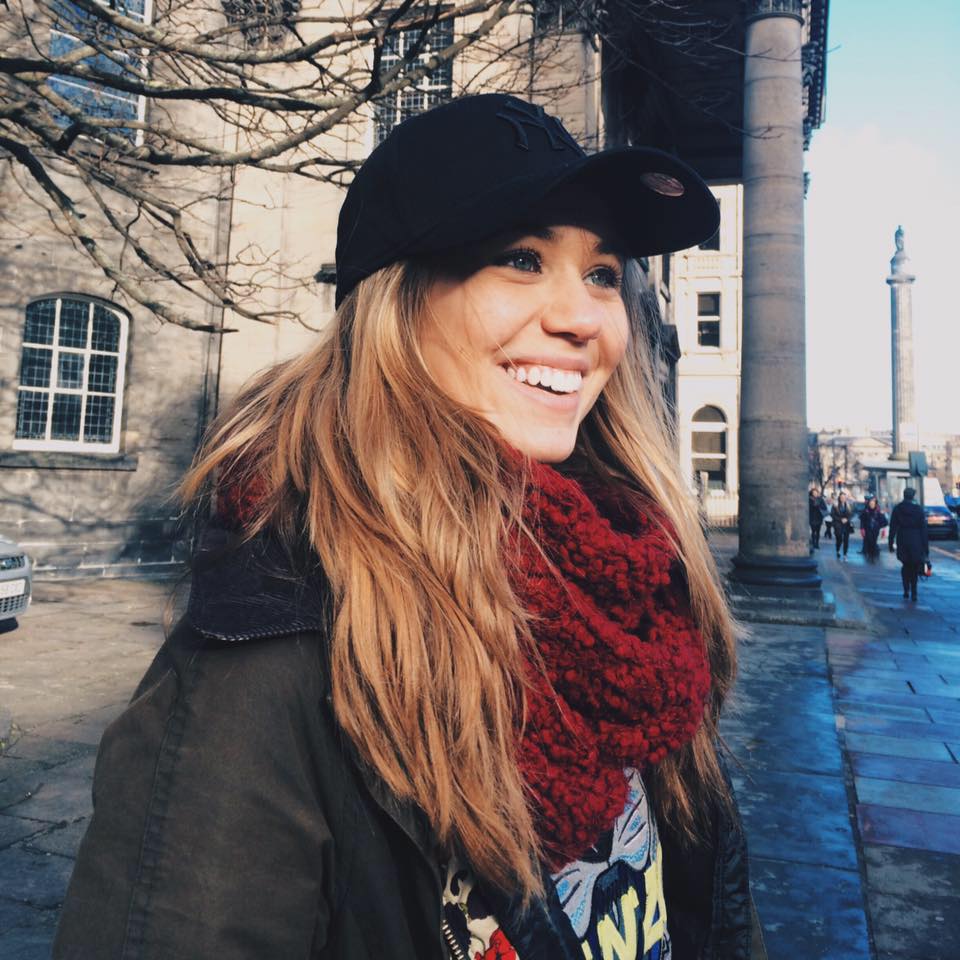 a woman wearing a hat and scarf