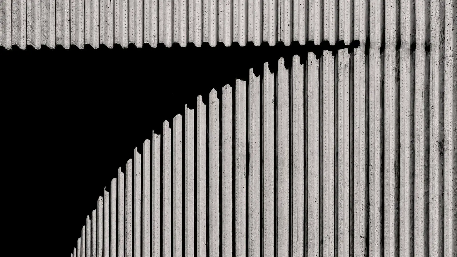 a black and white photo of a black and white striped wall