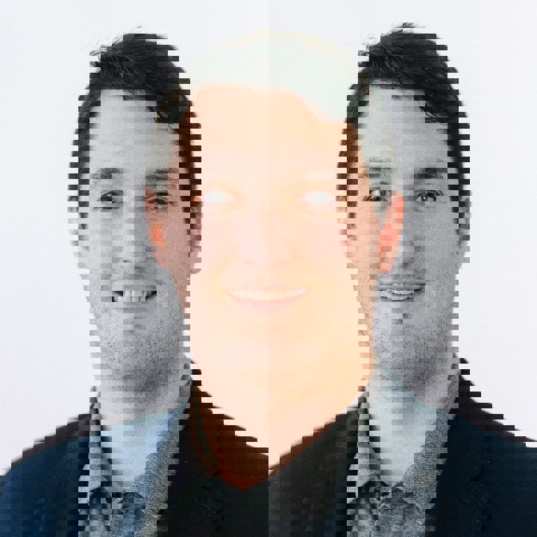 a man smiling for the camera
